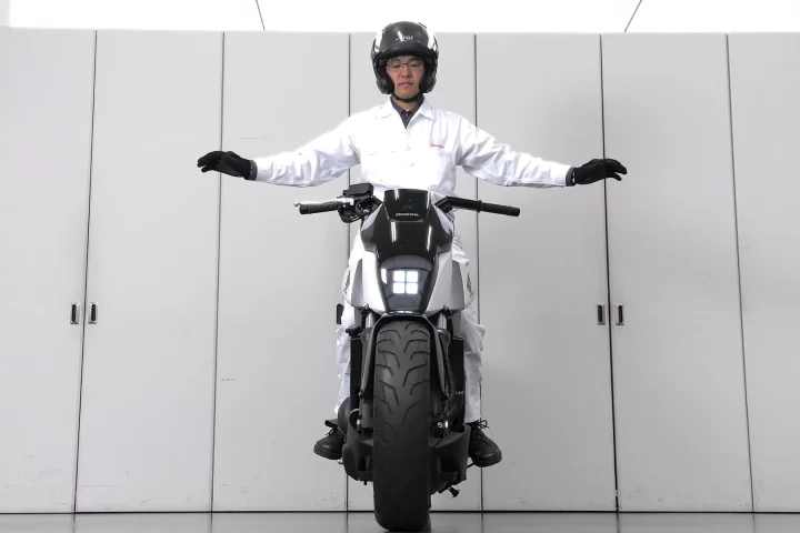 Honda's self-balancing motorcycle: I love to believe Honda R&D guys dress like this all day