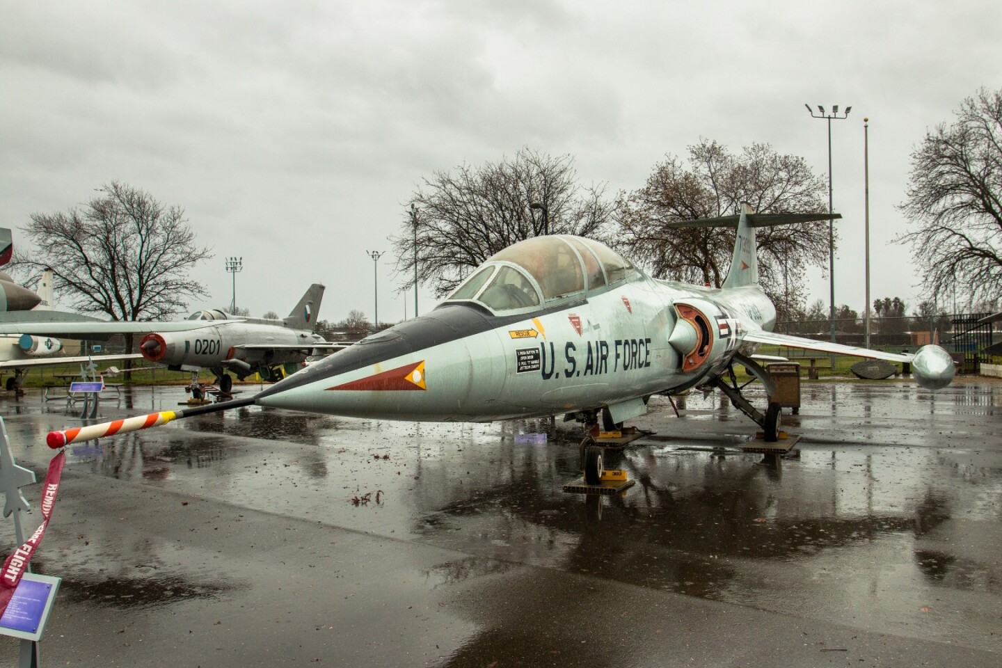 Lockheed's F-104B "Starfighter" was designed as a Mach 2.2 interceptor and air superiority fighter. Its exceptionally small, thin wingspan of just 21 ft (6.4 m) meant that it needed to blow air back from the engine over the upper wing surface in order to generate lift at low speeds. Its top speed was limited not by drag or engine thrust limitations, but by temperature, caused by air friction on its aluminum airframe. This example was used by NASA to train pilots on how to land both the Space Shuttle and the X-15, and also as a chase aircraft