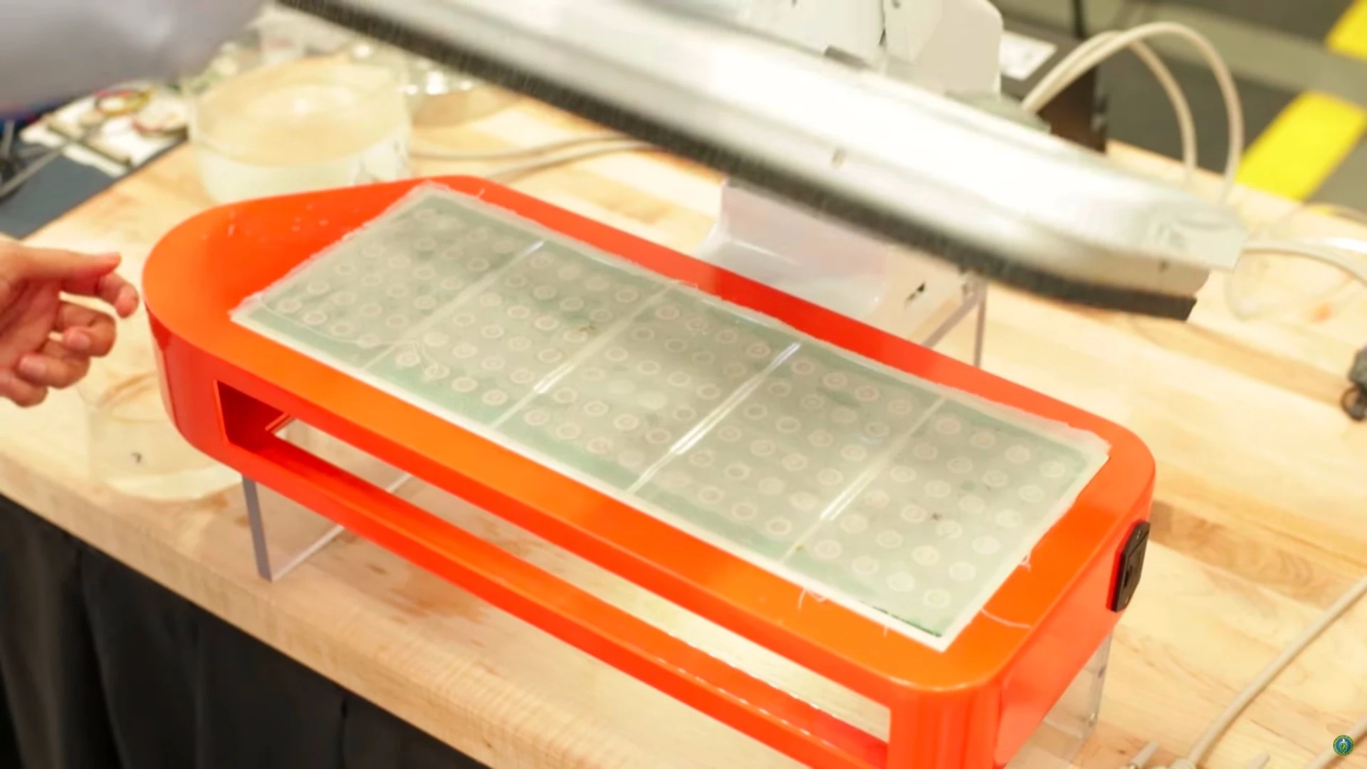 The transducers responsible for producing the ultrasonic vibrations can be seen in the base of the press dryer