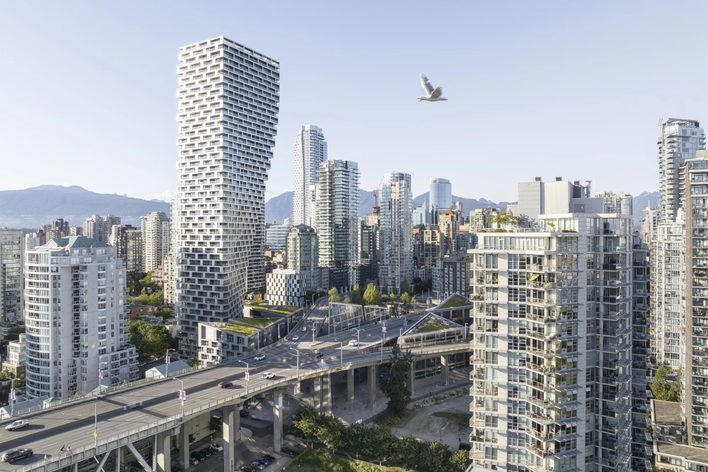 Vancouver House's unusual top-heavy form came about because local planning regulations state that the tower must be no less than 30 m (98 ft) from the nearby bridge until it reaches a height of 30 m (98 ft)