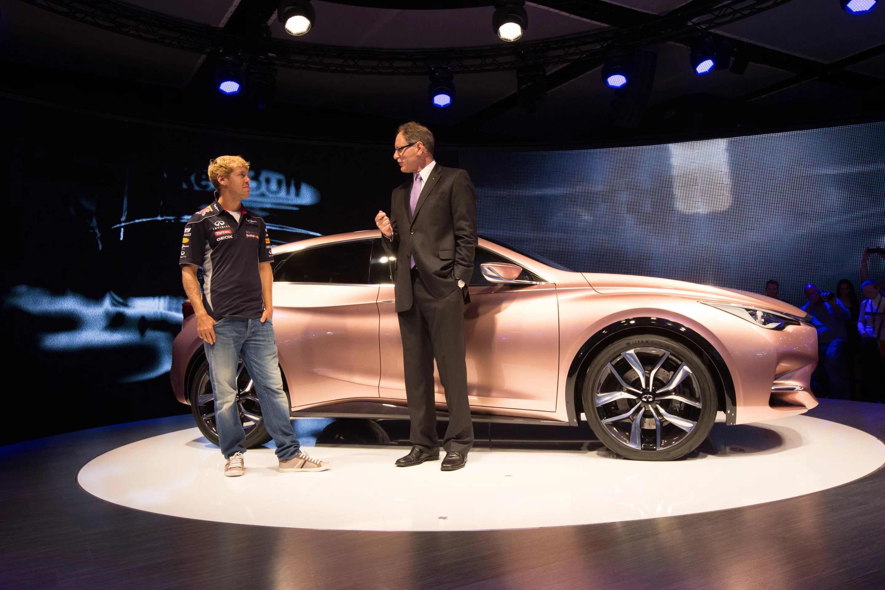 The metallic gold delivery and a promotional drop-in from Formula One champ Sebastien Vettel will doubtless enhance the car's prestige