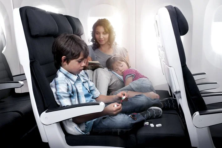 The Air New Zealand Sky Couch converts seat leg-rests into a lying space (Credit: Air New Zealand)