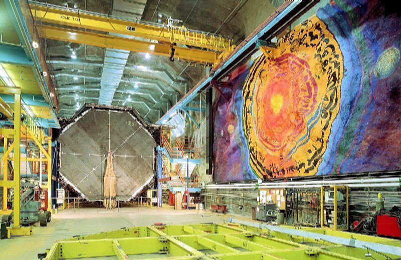 The first stages of installation of the MINOS detector, showing a mural painted by Joseph Giannetti, both buried over a kilometer deep (Photo: Fermilab)
