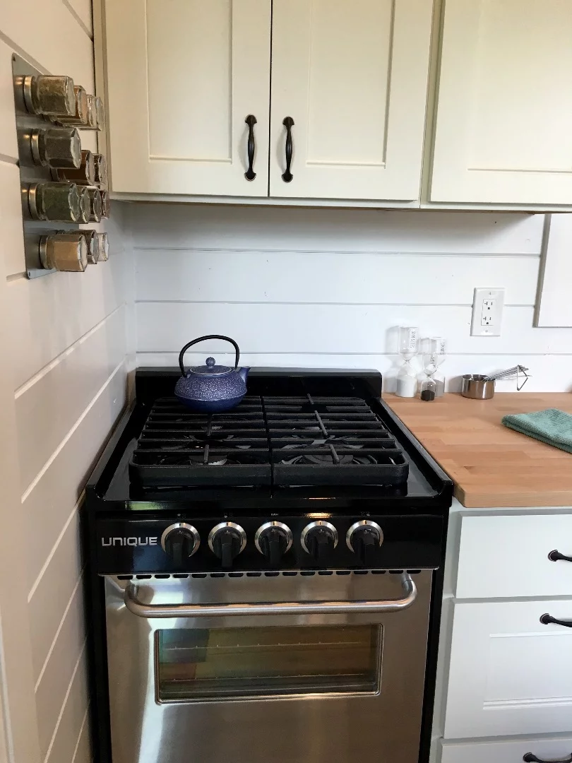 The Rocky Mountain Tiny Home's kitchen includes a range cooker