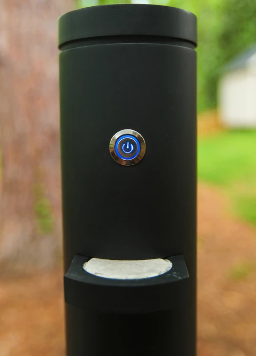 Once the water reaches the preset temperature, it drips through a hole and onto the coffee pod which is seated in a sliding tray in the center of the mug