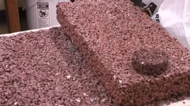 Plastisoil is a concrete-like substance made from discarded plastic bottles, that rain water can pass through instead of running into storm sewers