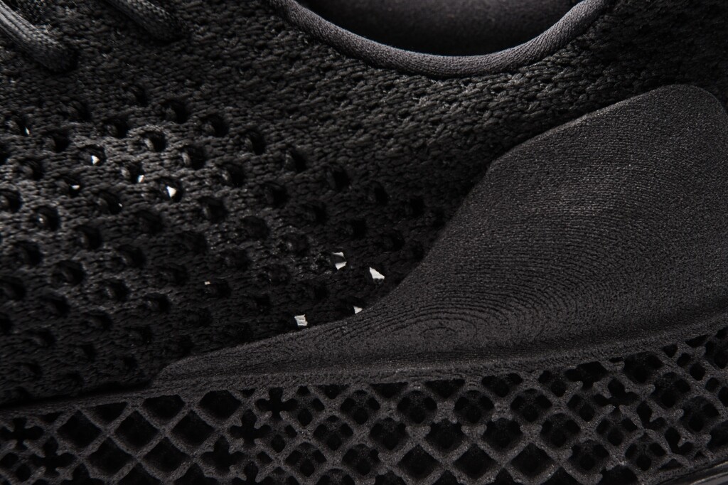 A 3D-printed web structure with varying density and a 3D-printed heel counter make up part of the shoe