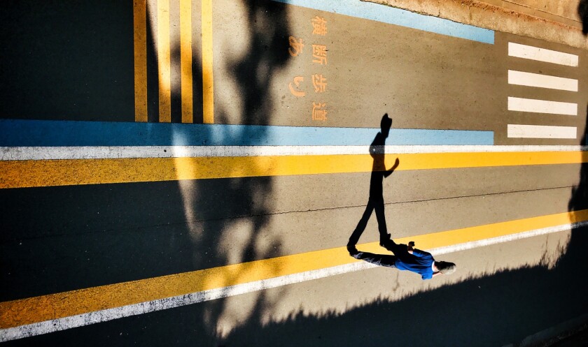 1st place winner in the Street Photography category. Running On Empty, shot on an iPhone7 Plus