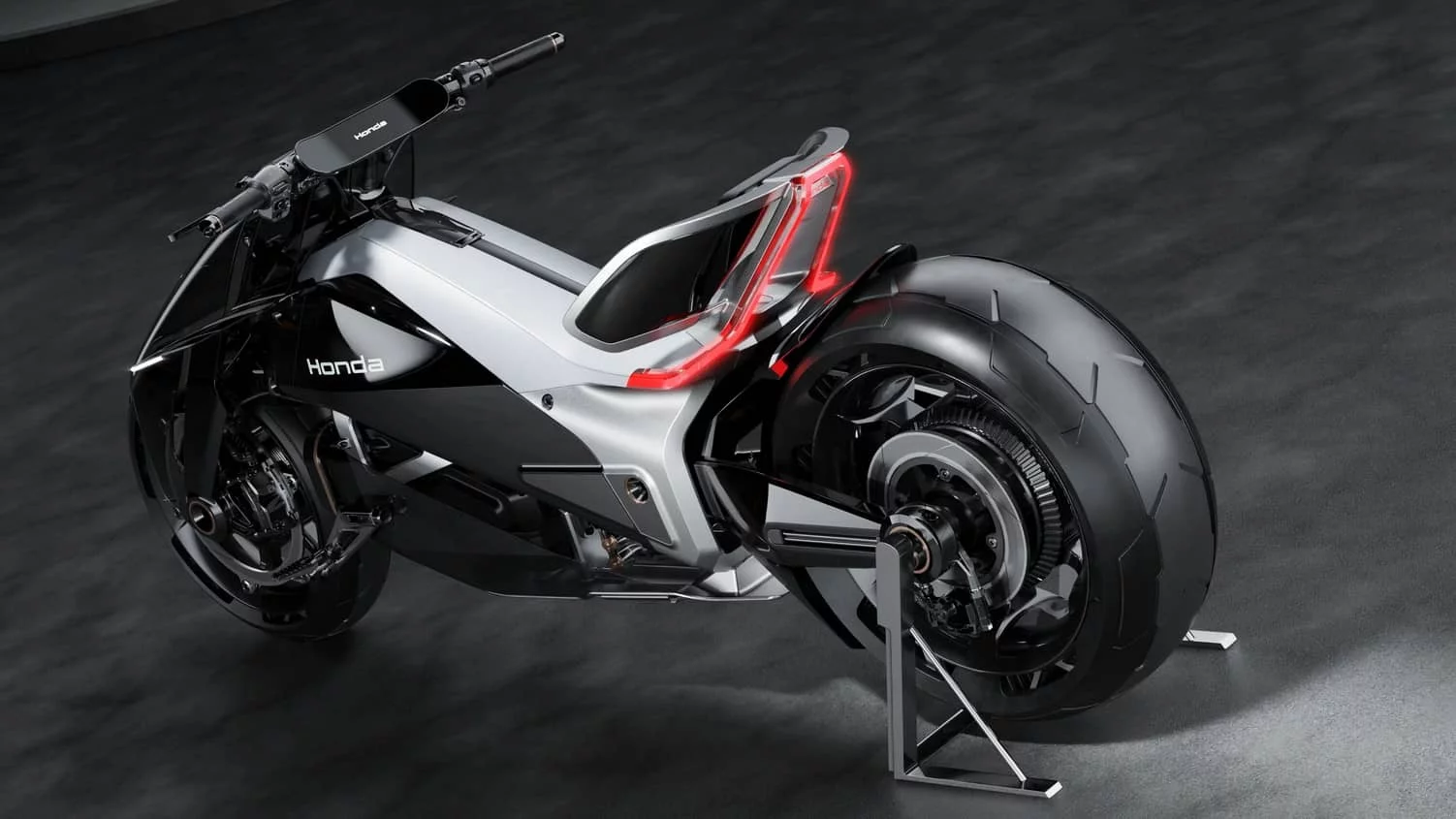 The concept is based around an aluminum chassis and a rear swingarm. The battery pack is centrally positioned and hangs low within that aluminum frame.