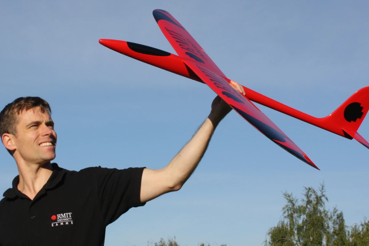 Dr Reece Clothier with a prototype of a bio-inspired unmanned aircraft, under development at RMIT