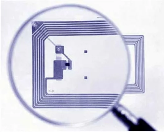 Passive RFID sensor chip and antenna on printable substrate - total size 3.0 x 2.4 cm