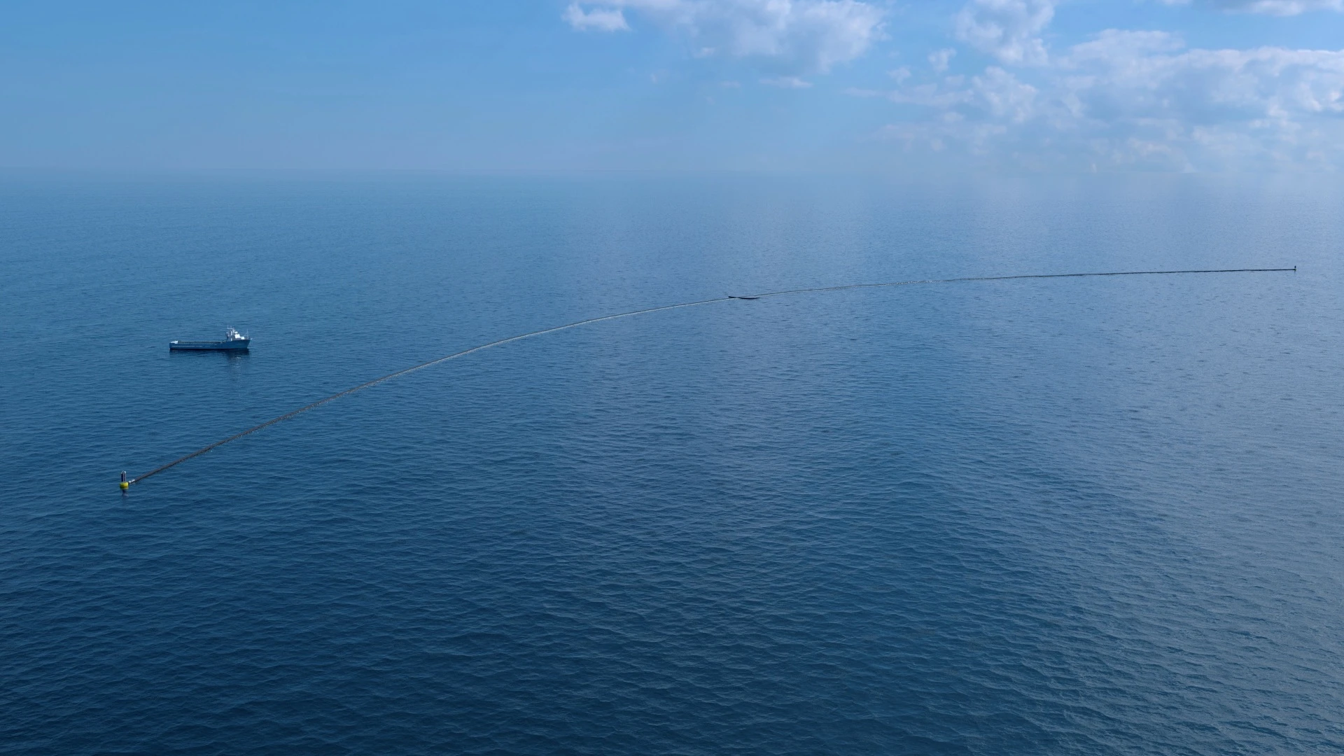 The Ocean Cleanup computer rendering, system with support vessel