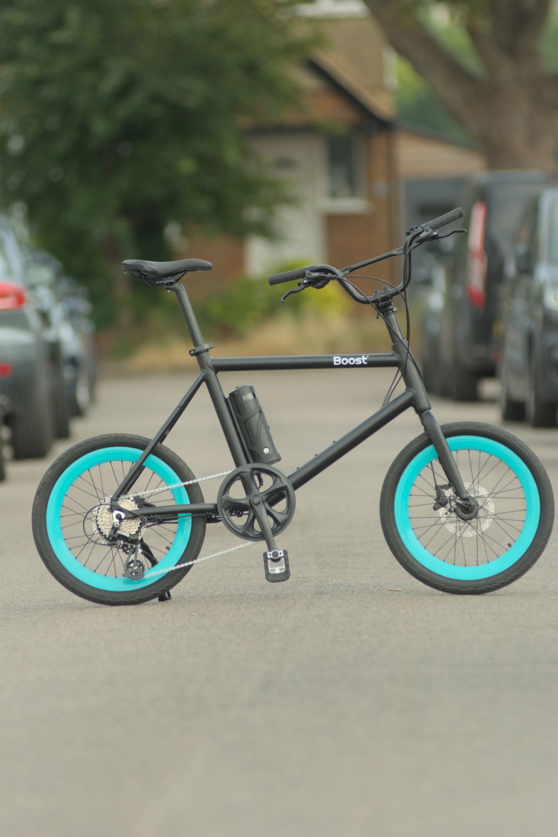 The Boost mini-bike is designed for "riders between 150-187cm tall, with a long seatpost to adjust the saddle height, and easy reach adjustment with the BMX style handlebars"