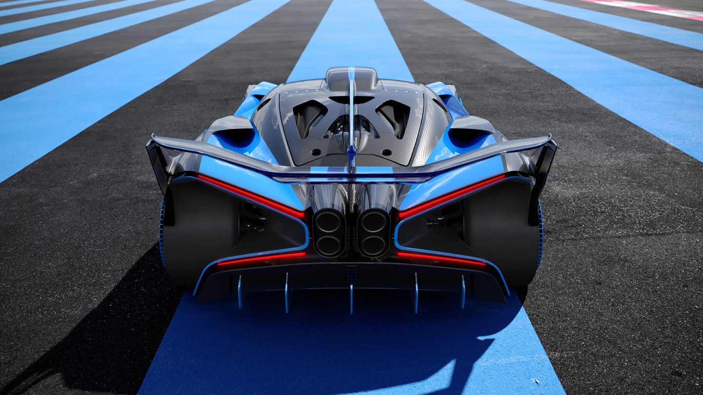 The Bolide rear-end fuses together a centralized quad exhaust, adjustable wing, diffuser and X-shaped bodywork and lighting