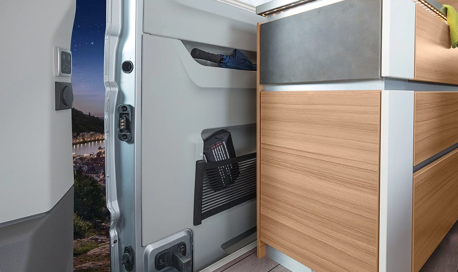 As is common in camper vans, the kitchen area is located just inside the sliding door