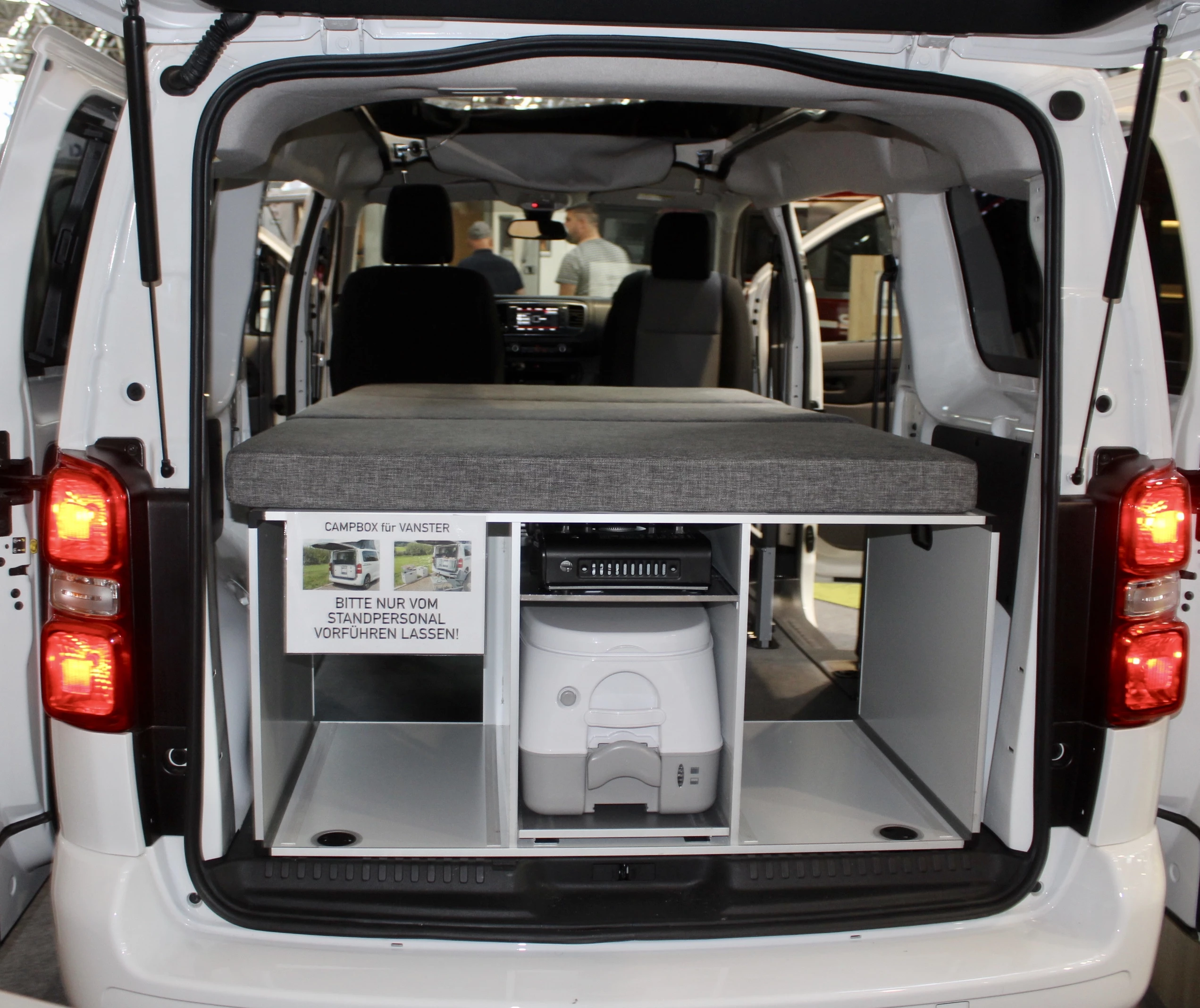 Looks like that center compartment can hold a toilet in place of a fridge
