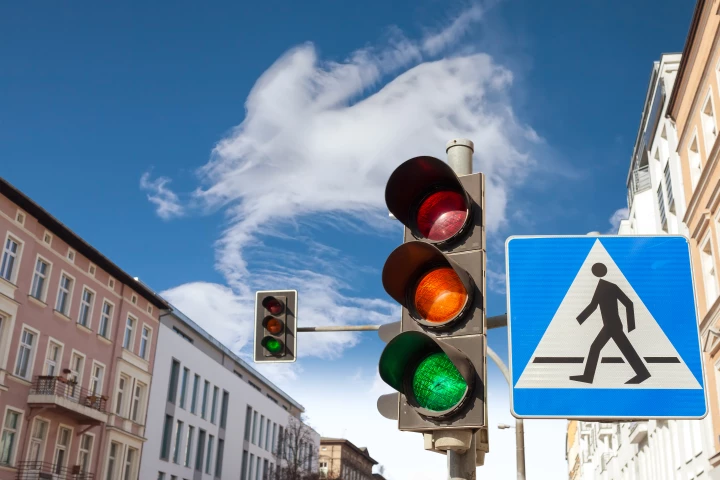 An additional white traffic light could improve both vehicle and pedestrian traffic