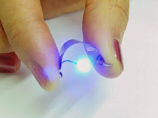 A NanoEnergy battery powering a blue LED