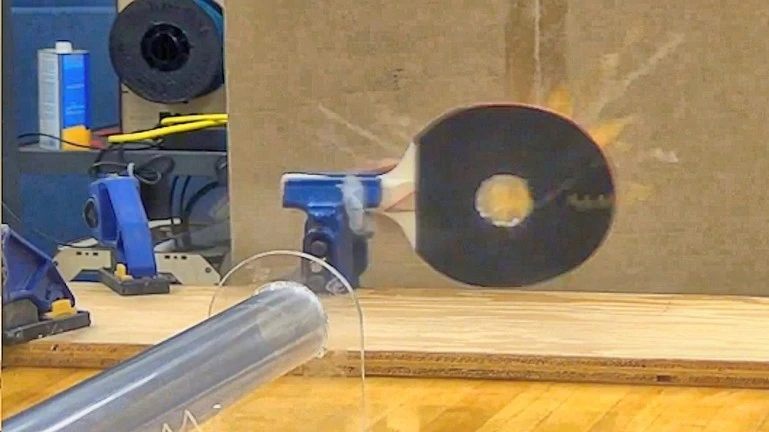 Supersonic ping-pong ball cuts cleanly through a standard paddle (Photo: Mark French)
