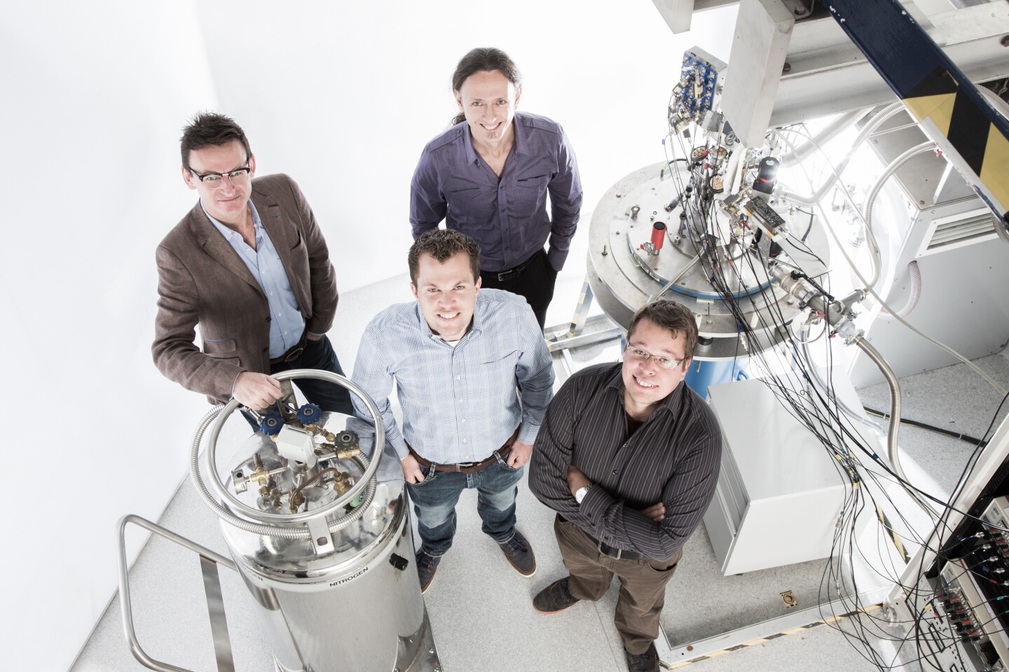 Andrew Dzurak and Andrea Morello, with paper lead authors (L-R) Menno Veldhorst and Juha Muhonen (Photo: Paul Henderson-Kelly/UNSW)
