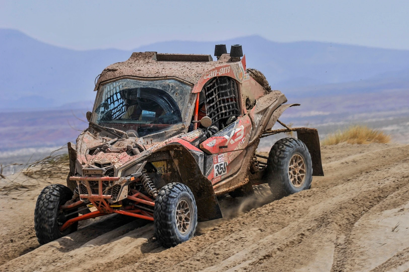 The Uribe brothers' Can-Am side-by-side is looking quite second-hand by the middle of Stage 8