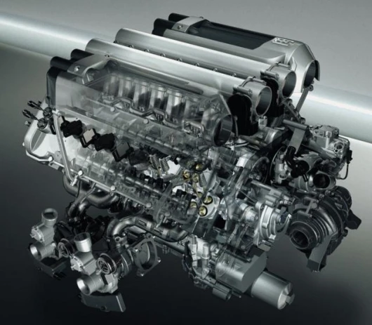 The Bugatti Veyron engine engine has 16 cylinders, eight camshafts, four turbochargers, 64 valves and produces 1001 horsepower.