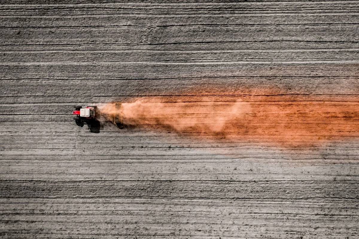 The color changes as a farmer prepares a berry farm in early spring outside of Peterborough, Ontario