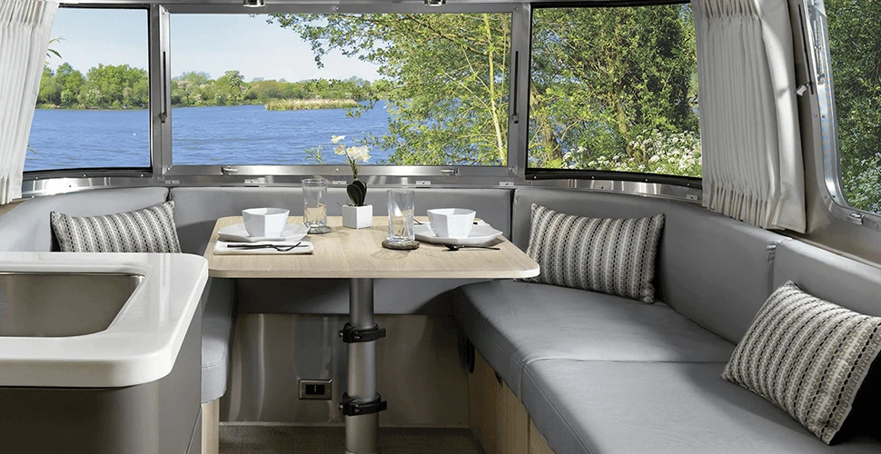 The Airstream Globetrotter's lounges pull out for extra bedding and are covered in finely woven, stain resistant fabric