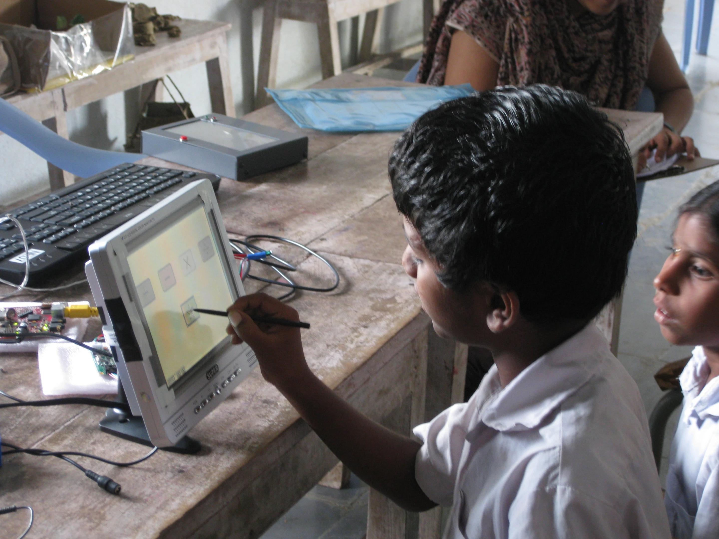 An Indian student trying out a prototype of the I-slate