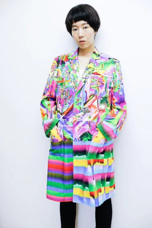 The Glitch Coat by Nukeme is a glitch design printed onto a plastic lab coat