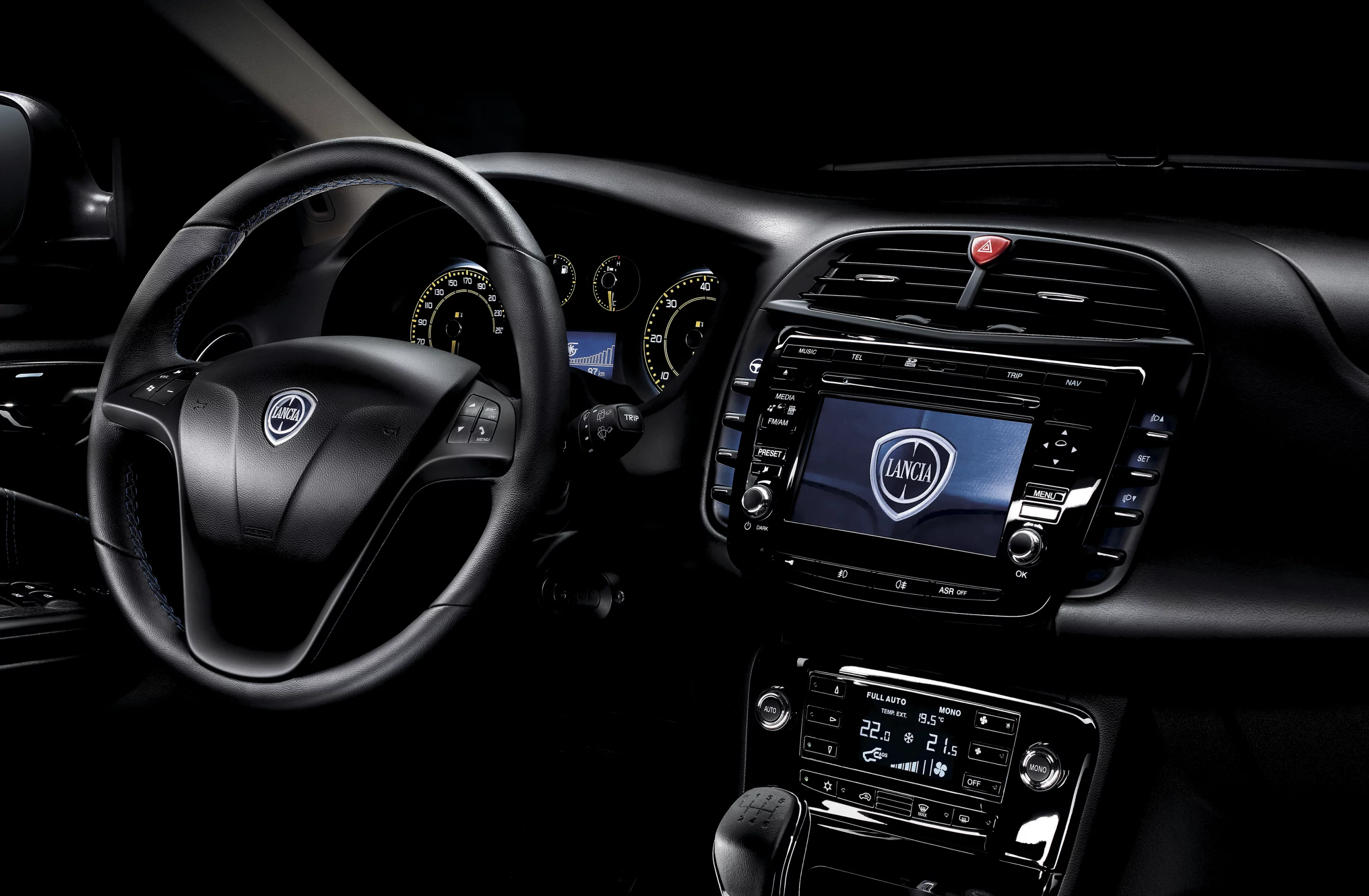 Gloss black central console, yellow detailed speedo, blue stitching on the steering wheel, gear lever gaiter, handbrake lever and door panels all standard