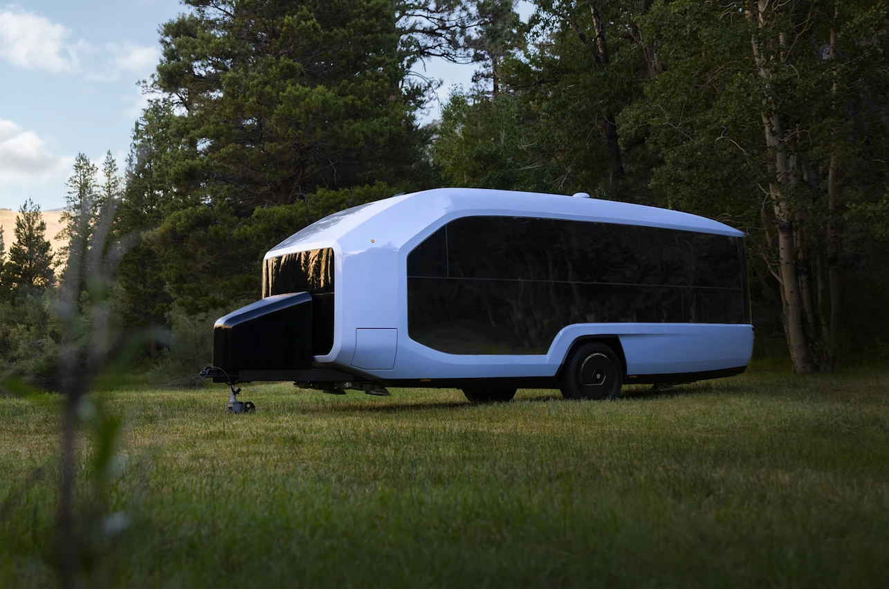 The Pebble Flow smart trailer features a sleek, simple design with windows all over to connect occupants with nature