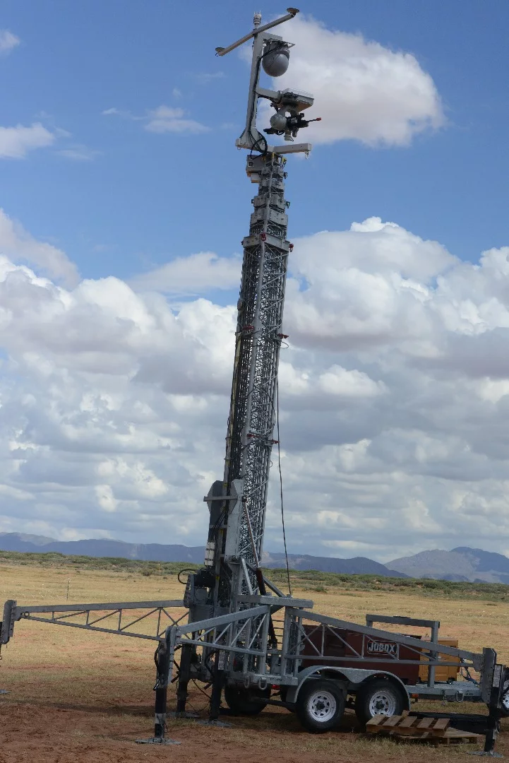 A remotely-controlled weapons system is shown on the expeditionary base camp perimeter