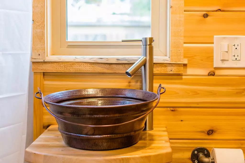 The copper pail sink in Davis's 22 ft Off-Grid Tiny Home