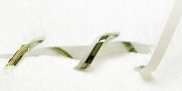 Smart sutures that contain ultrathin sensors to detect when a wound is infected.(Image: John Rogers)