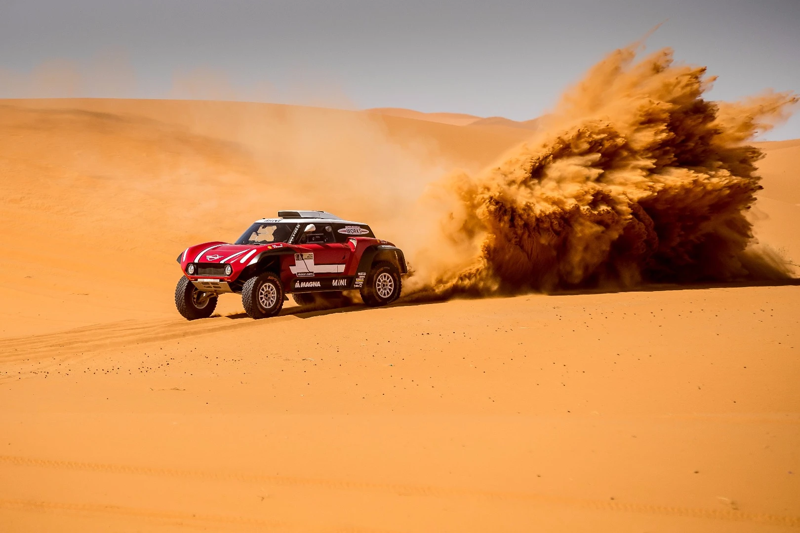 The Mini JCW Buggy kicking up a sandstorm in the desert
