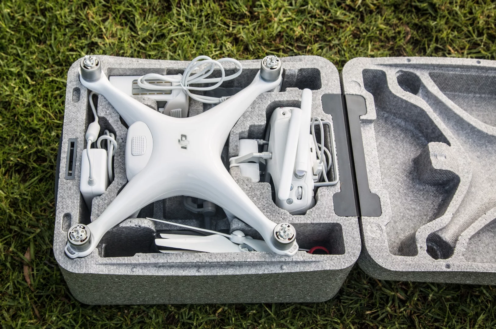 DJI Phantom 4: ships with a twist-to-lock foam carry case that should fit inside a backpack
