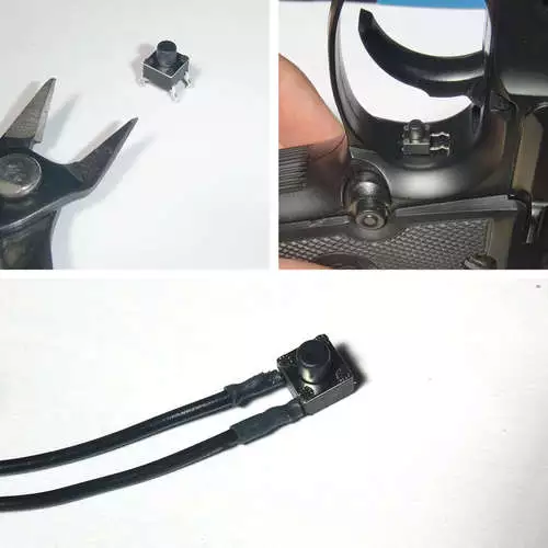 The original toggle switch was replaced with a black momentary switch positioned behind the trigger