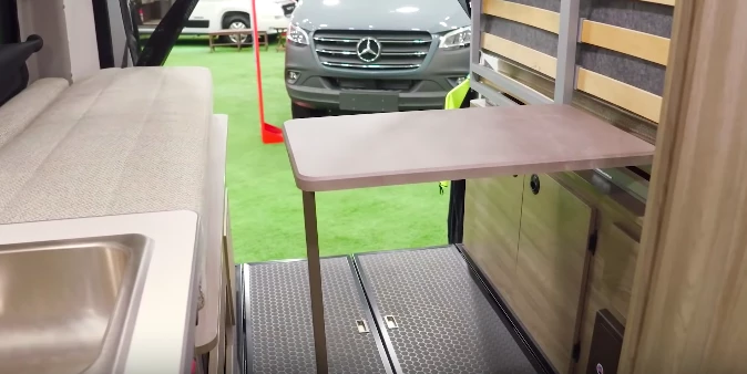 One of the signature features of the Solis is the under-bed table that folds down for a more scenic work/play/dining station