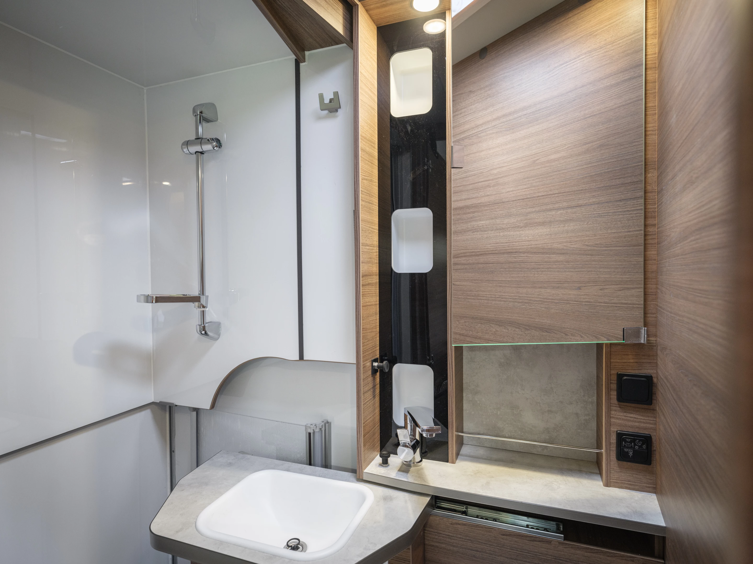 The sink slides out of the way for better toilet access (pictured on the Tourer Van)