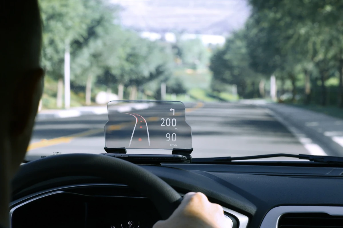 The Hudway Glass is a smartphone cradle that sits on top of your car's dashboard and reflects images from a phone's display onto a curved plastic screen