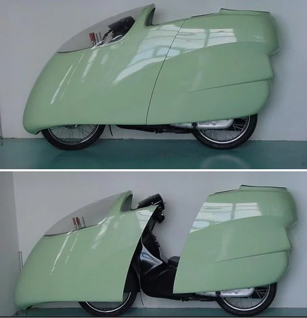 Getting in and out of the casing is made possible by splitting it in two and attaching the front to a sliding rail