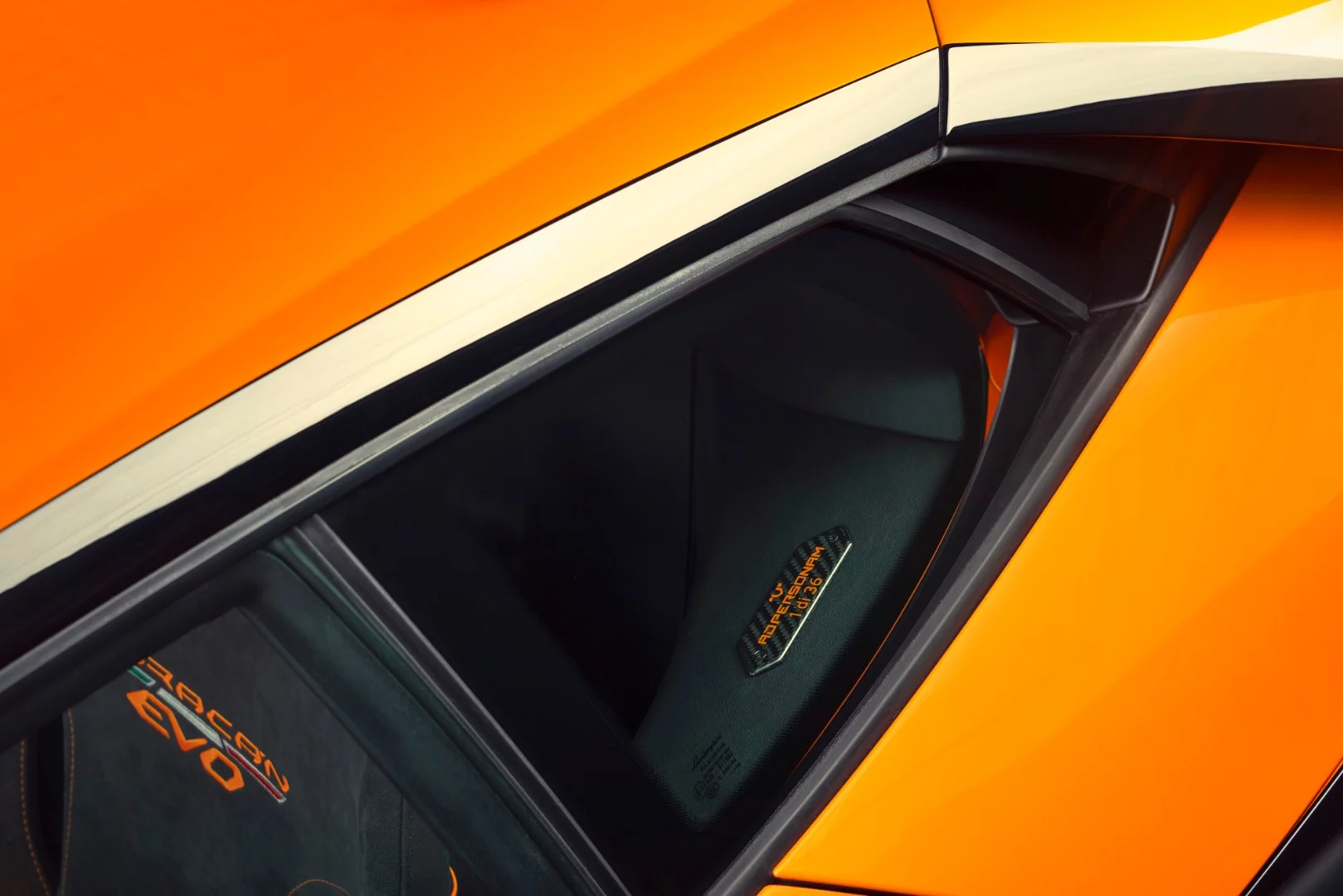 A plate inscription on the driver's side B-pillar notes "1 of 36" for the car's numbering