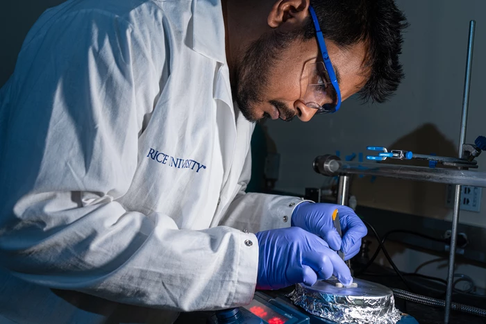 Rice University graduate student M.A.S.R. Saadi applies the novel coating to a piece of mild steel