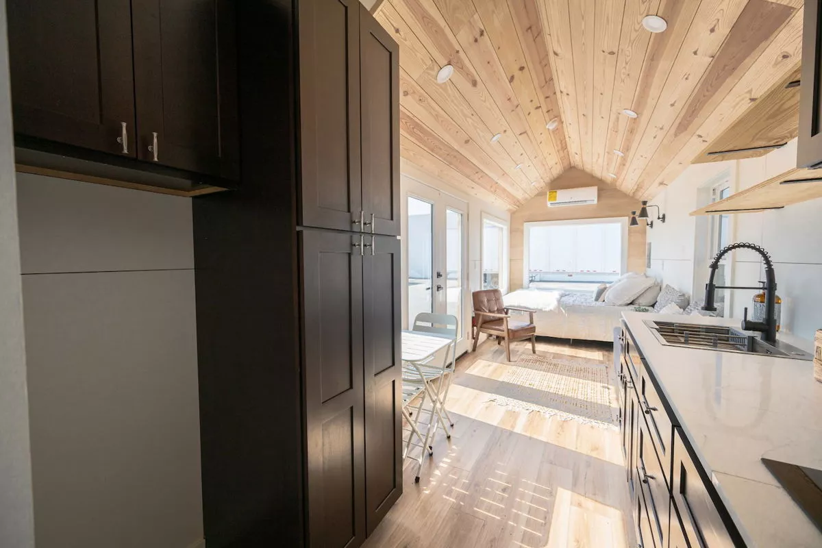 The 28' Model Tiny's kitchen includes quite a lot of cabinetry