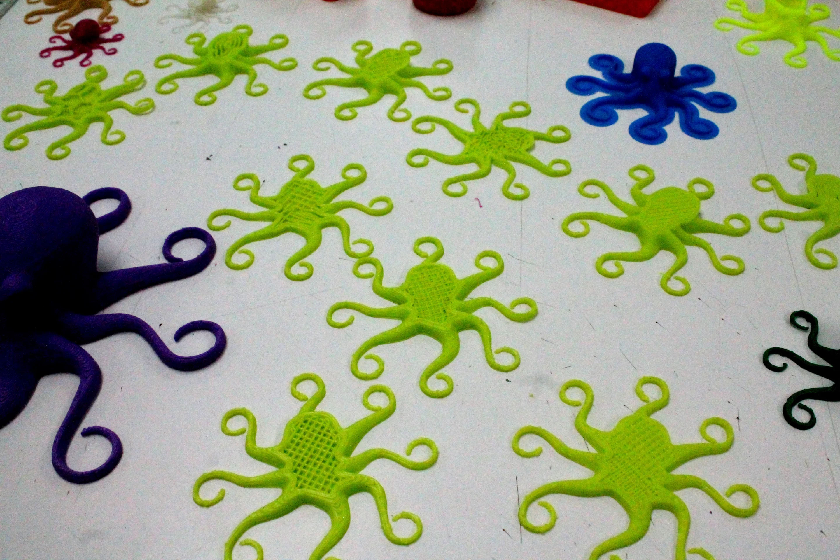 Blue bins house parts printed on TAZ 3 and AO-101 printers, the parts themselves destined for future printers