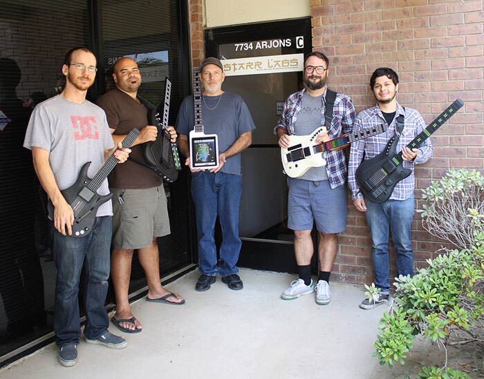 The Starr Labs team showing some of the company's digital instrument creations - with Harvey Starr (middle) holding the new iTar