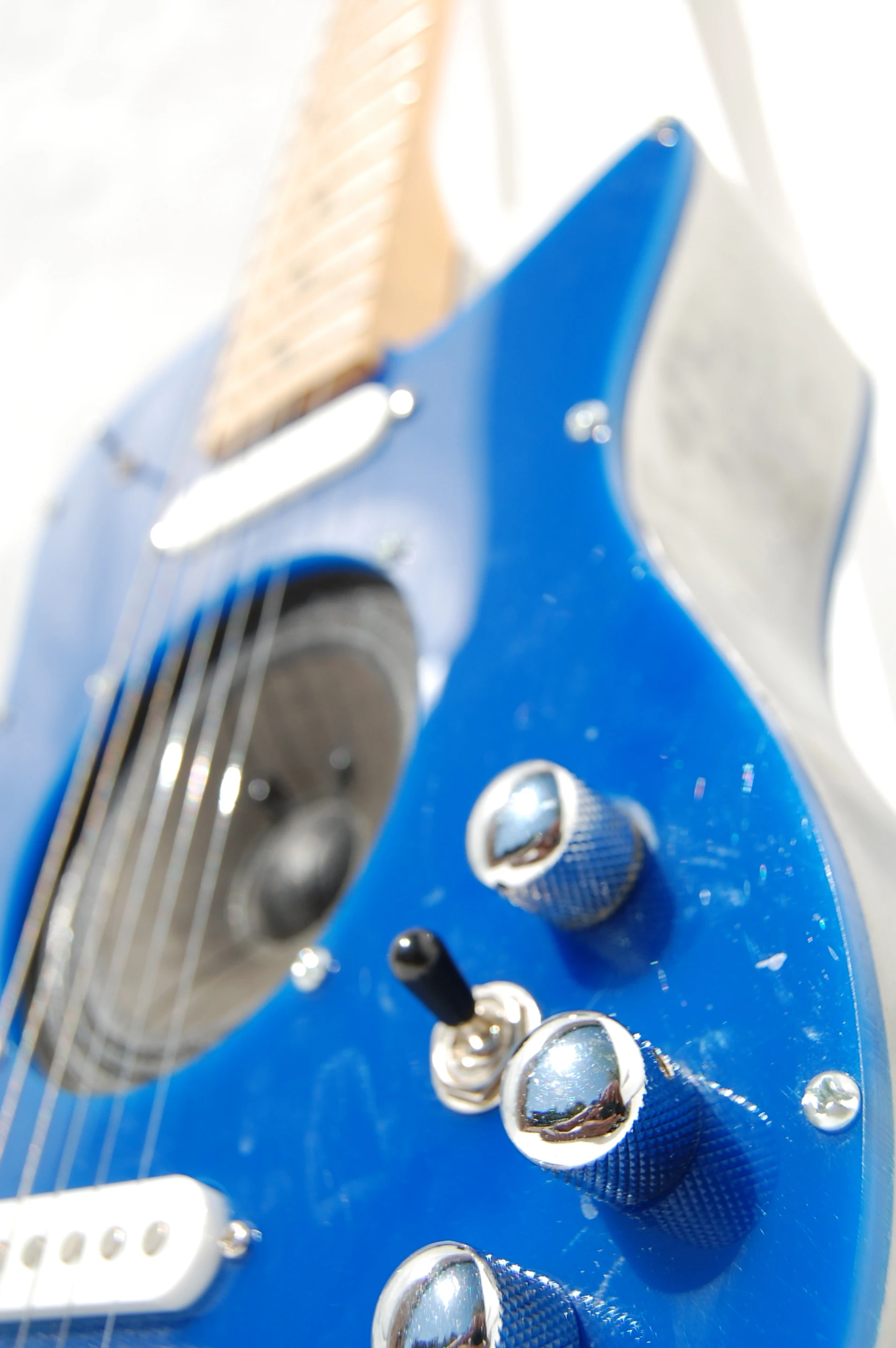 The Ultimate development team intends to combine the on/off circuitry with the volume knob and replace the pickup switch with a tone knob