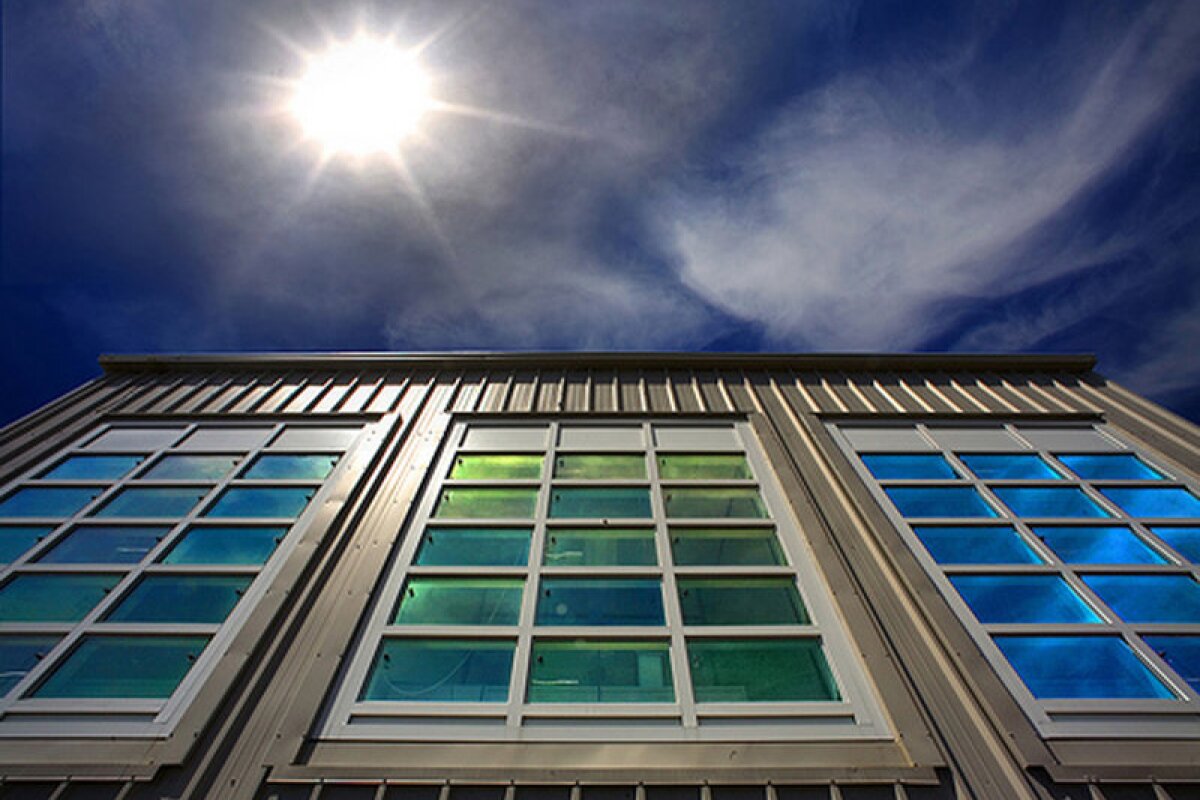 Image of windows treated with a nanocrystal material that can selectively block light and/or heat to improve energy efficiency