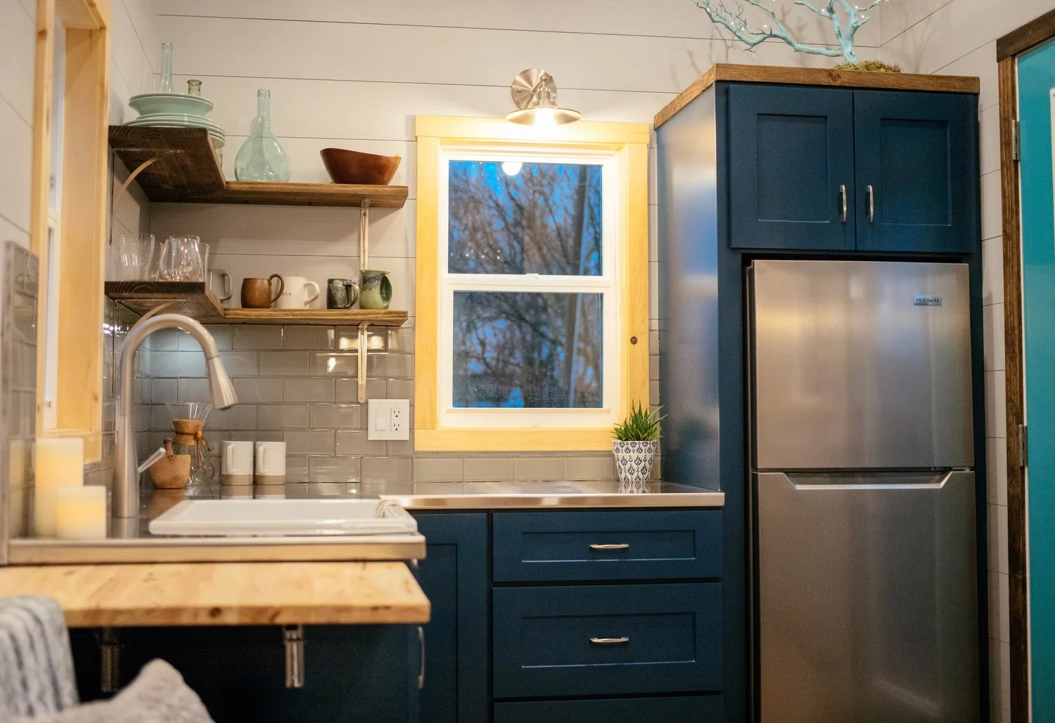 The Lykke's kitchen features a small drop-down table